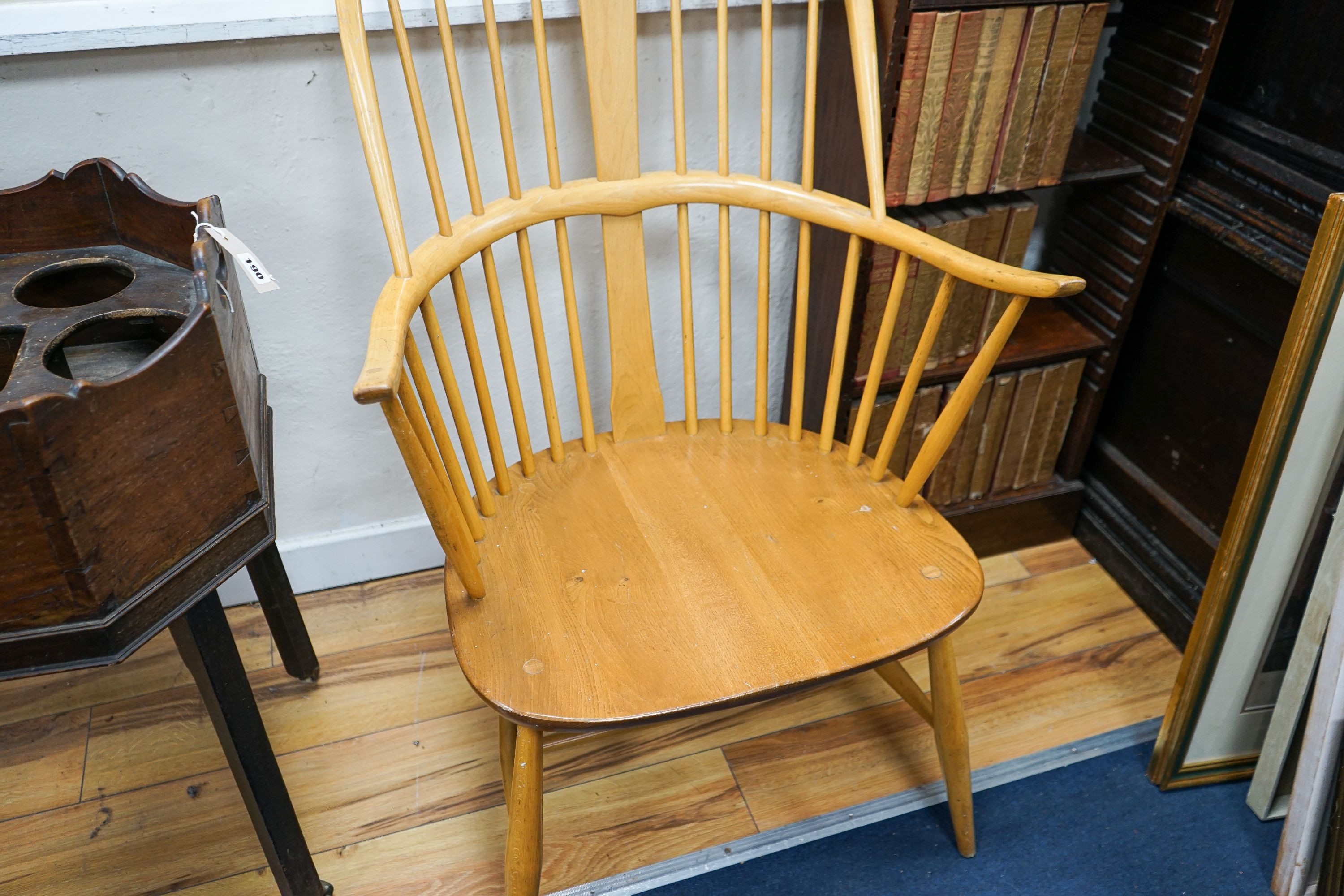 An Ercol light elm and beech comb back Windsor armchair